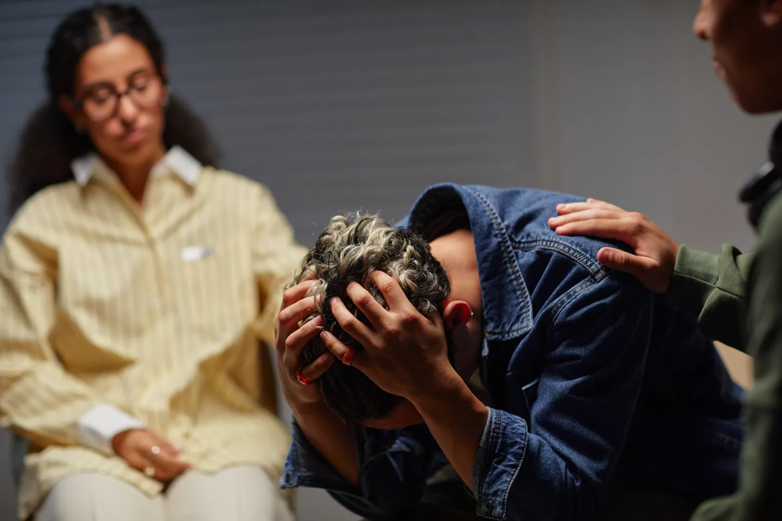 A colleague comforting someone who is distressed