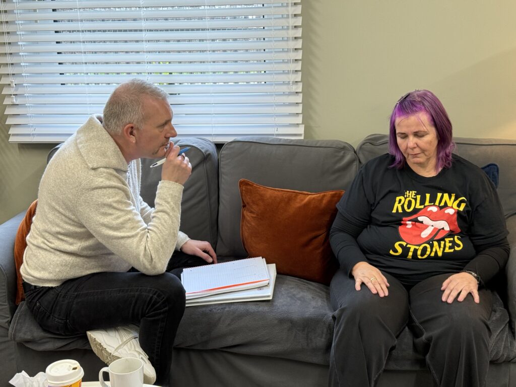 A hypnotherapy student practising a session with a classmate at the Glasgow training centre