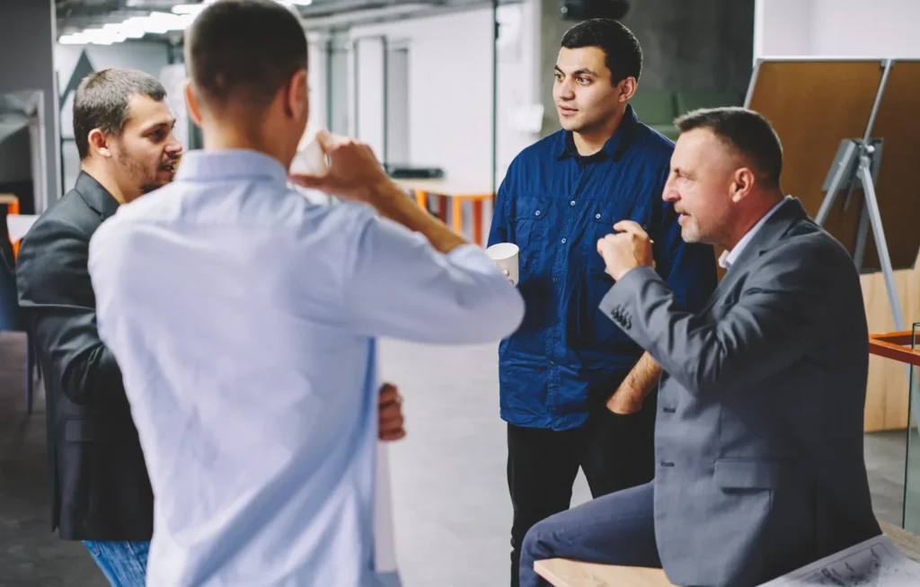Colleagues talking together at work after a difficult event