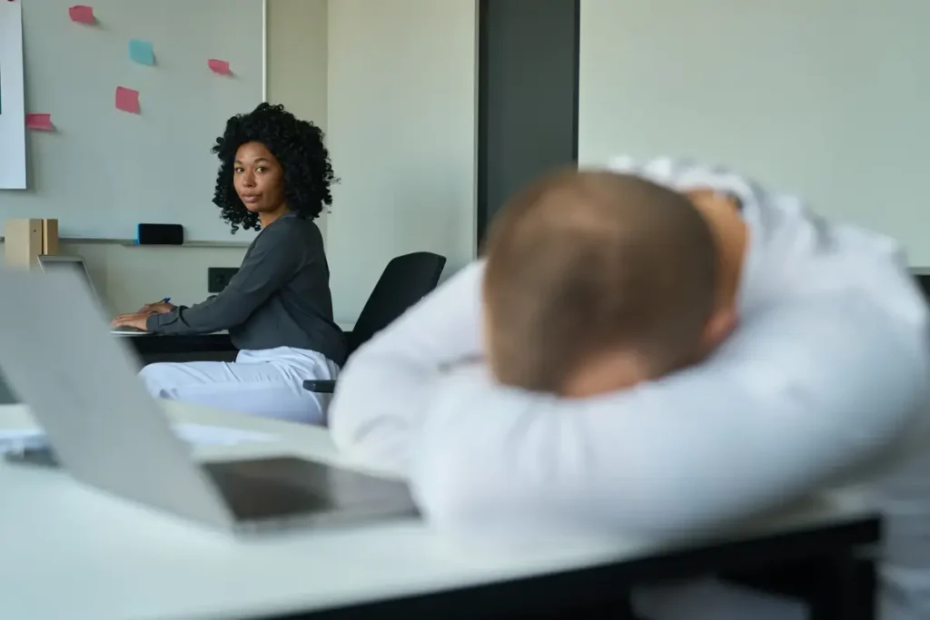 A colleague notices a coworker slumped over his desk at work